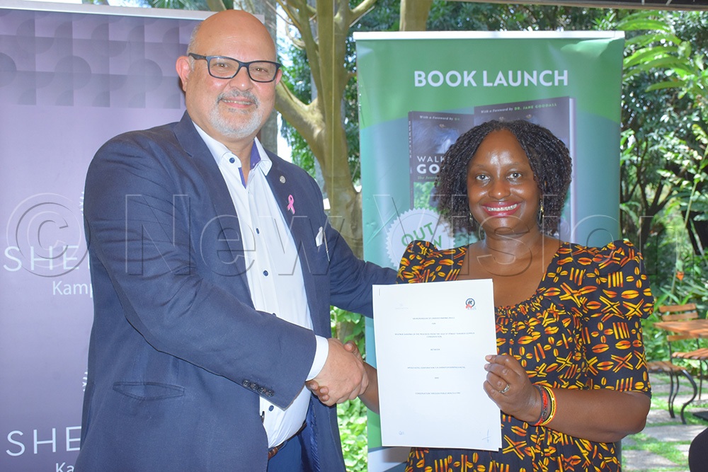 Sheraton general manager Jean-Philippe Bittencourt (left) and Gladys Kalema Zikusoka after signing the conservation agreement on Friday. (Credit: Julius Luwemba)