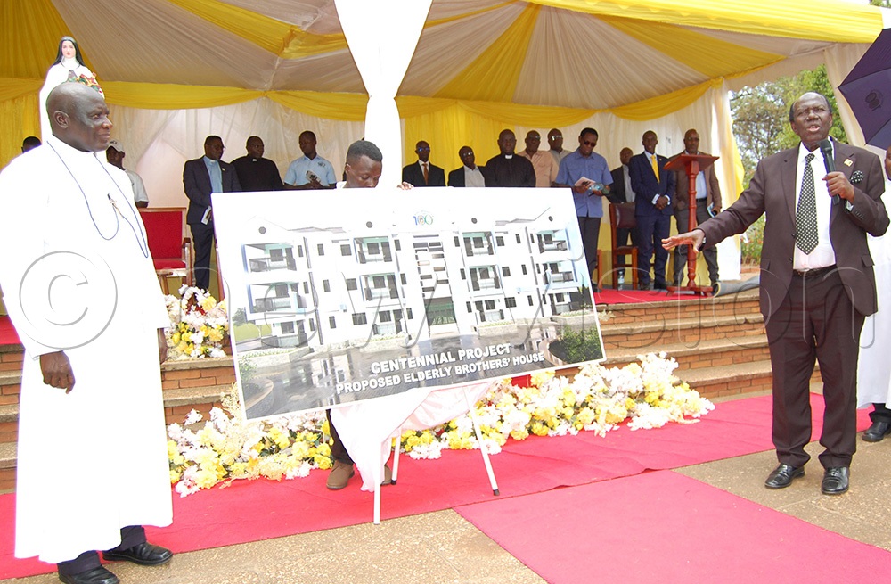 The Chief Guest, Eng. John Baptist Walusimbi (right) launches the project of the proposed community house of the elderly Brothers of Christian Instruction as the Brothers' Provincial Superior, Bro. Casio Aizire (left) looks on. (Photo by Mathias Mazinga)