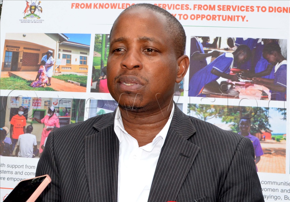 Dr Patrick Kagurusi the Country Manager Amref Health Africa Uganda speaking.