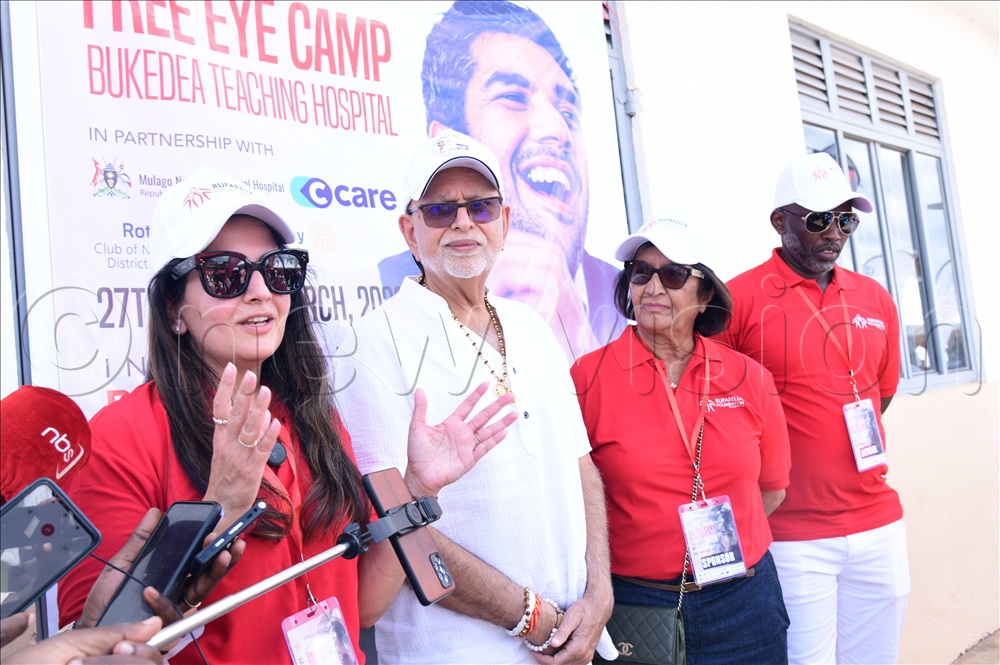 Sheena Ruparelia, the daughter of Ruparelia addressing the press on behalf of her family. Looking on is her father and mother together with Lawrence Muganga, the Vice-Chancellor of Victoria University. 