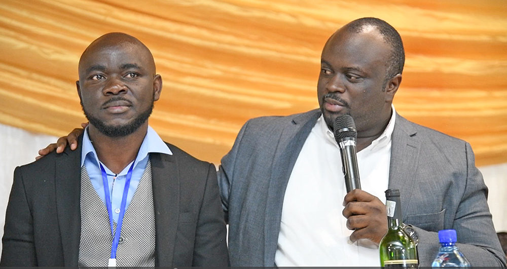 Matthew Bagonza (R), the head of the secretariat at Presidential Advisory Committee on Exports and Industrial Development (PACEID) applauds Michael Nyanzi (L), the proprietor of East Wine for being innovative. This was during a thanksgiving event at Distong cultural museum in Pretoria, South Africa.