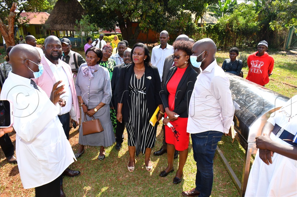 The Medical Director of Jinja Regional Referral Hospital, Dr. Alfred Yayi (left), explaining to the Deputy Chairperson of the Health Committee and Mubende District Woman Member of Parliament, Hope Grannia Nakazibwe (3rd right) and other Members of Parliament about challenges faced at the mortuary during inspection on September 07.