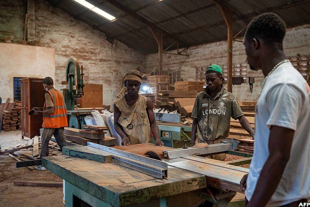Former street children learn carpentry at the OSEPER training centre in Kinshasa