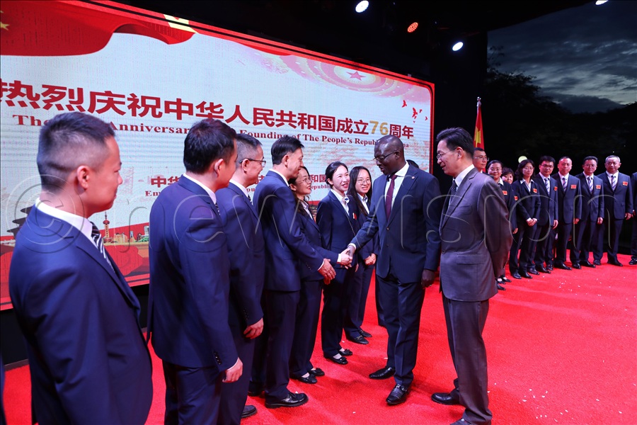 Lizhong and Mulimba interact with the outgoing Chinese medical team during the Chinese National Day celebrations.