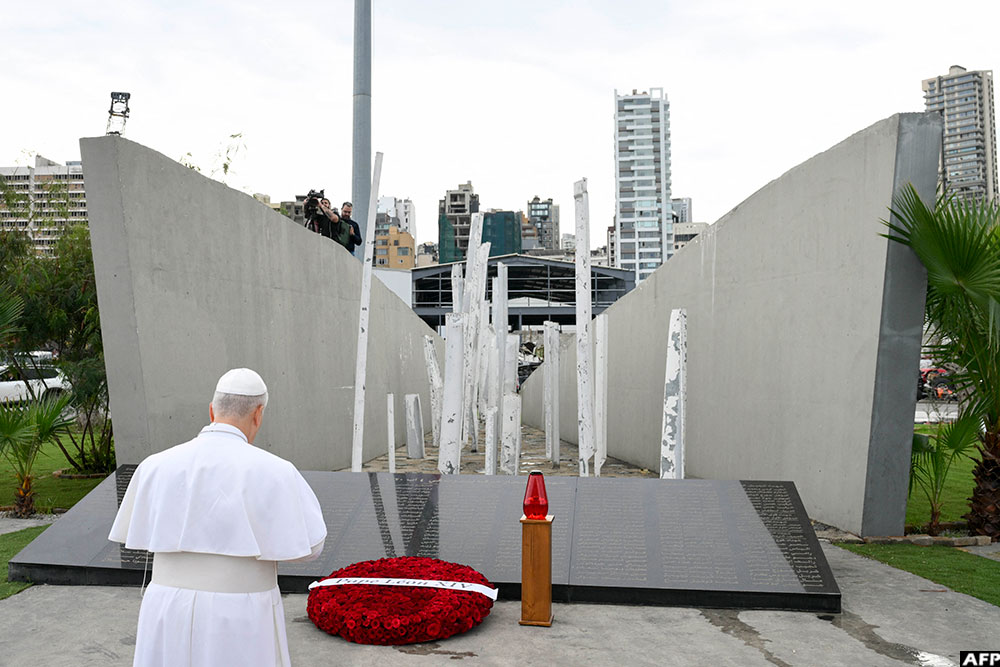 Pope Leo XIV prays at the site of the 2020 Beirut port explosion honoring the victims, during his apostolic journey, in Beirut on December 2, 2025. (AFP/Vatican Media)