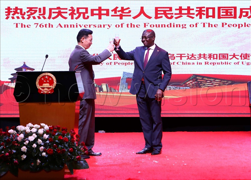 The Chinese Ambassador to Uganda H.E. Zhang Lizhong toasts during the Chinese 76th anniversary with the Minister of State for Foreign Affairs in charge of Regional Affairs John Mulimba during the celebrations at Sheraton Gardens in Kampala on September 26, 2025. (All Photos by Maria Wamala)