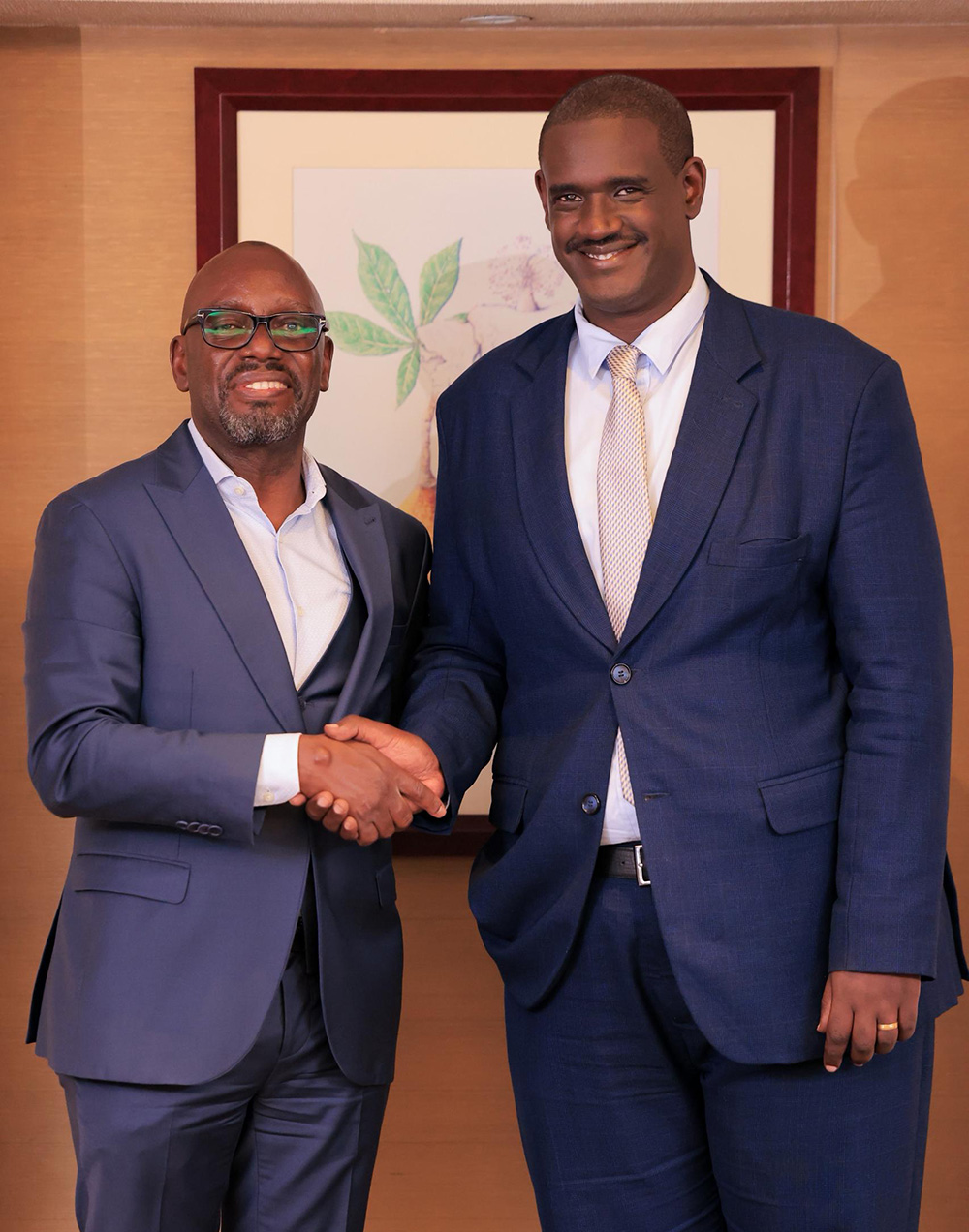 Ugandan lawyer Kabiito Karamagi shaking hands with lawyer Elison Karuhanga while posing for a photo after the Judicial Service Conversations. (Courtesy photo)