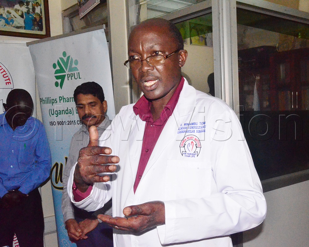 Dr Tom Mwambu, Senior Consultant Adult Cardiac Surgeon and Head of Adult Cardiac Surgery addressing guests during the handover of pacemakers. (Credit: Agnes Kyotalengerire)