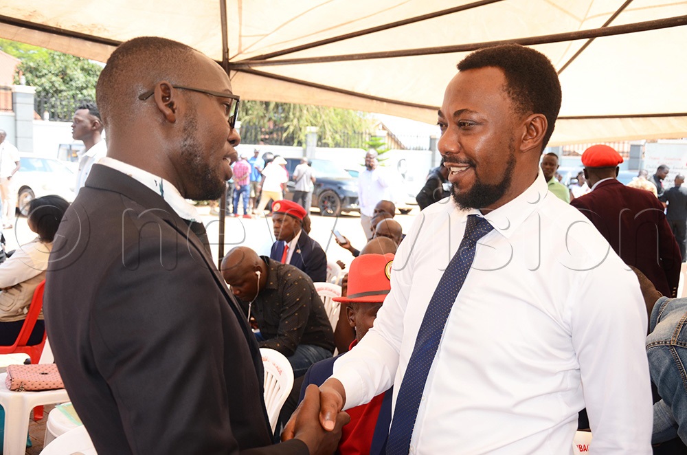 The Busiro South MP Charles Matovu shaking hands with a supporter during the vetting exercise at NUP party headquarters in Makerere Kavule on Monday. (Photo by Isaac Nuwagaba)