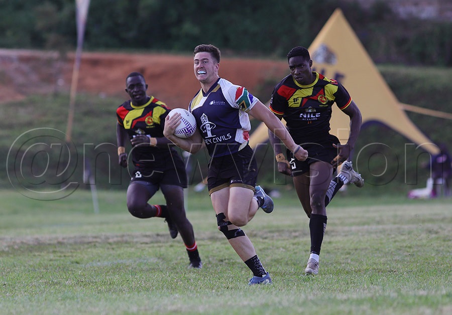 South Africa's All Star Academy player breaks through to score a try against Uganda Emerging Cranes