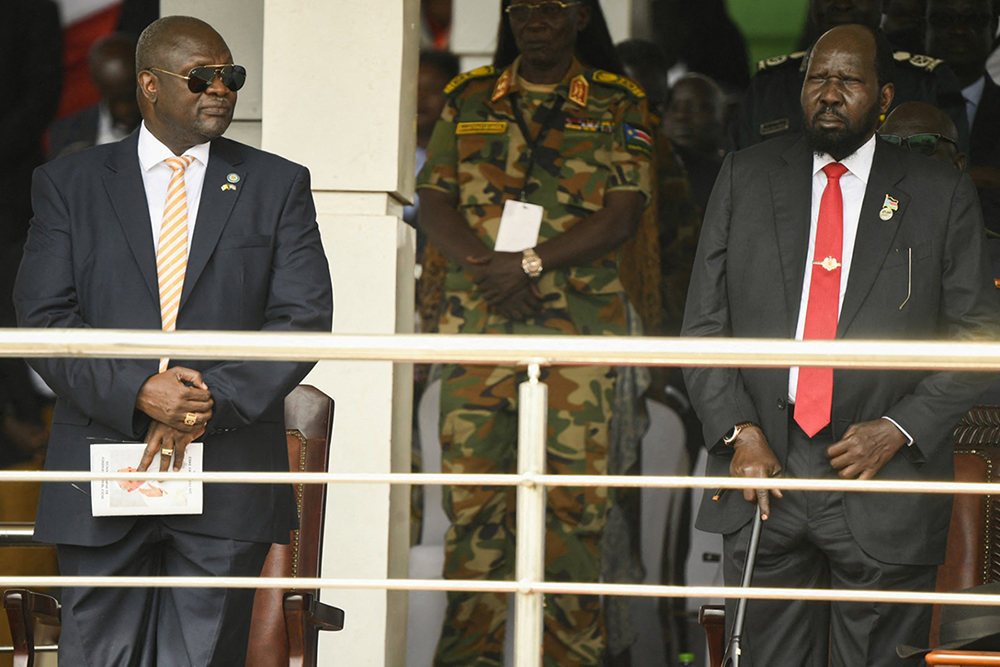 Vice President of South Sudan Riek Machar (L) and President of South Sudan Salva Kiir (R) attend the the holy mass that Pope Francis (not seen) is presiding over at the John Garang Mausoleum in Juba, South Sudan, on February 5, 2023. (AFP)