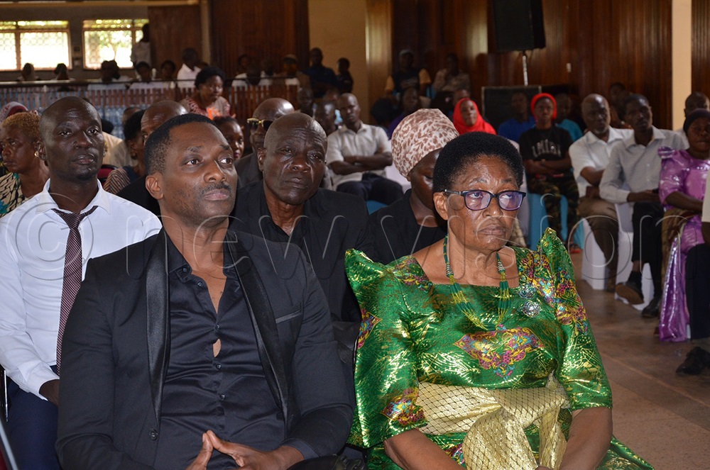 Christine Kagoya Nabwiso, the widow and one of their sons Andrew Nabwiso during a special Jinja city council meeting in which the deceased was honoured on Friday. (Credit: Jackie Nambogga)