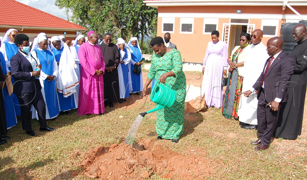 Christians look on as Vice-Pesident Jessica Alupo plants a memorial tree for the silver jubilee of Mount Sion Prayer Centre Bukalango. (Photo by Mathias Mazinga)
