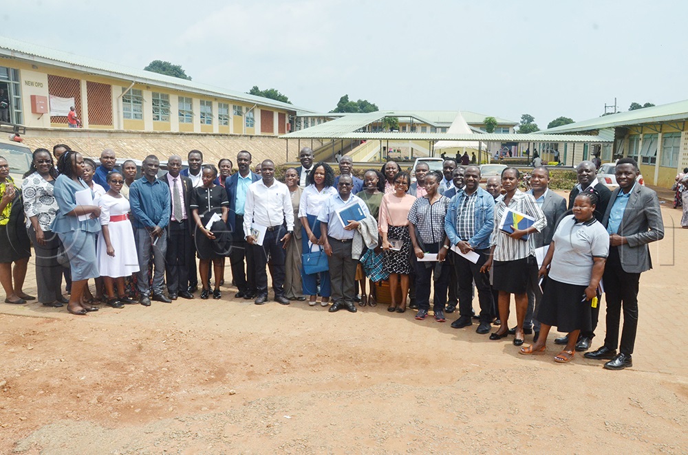 MOH officials, development partners, staff of Nakasekere hospital and experts in NCDs pose for a photo at Nakaseke hospital. (Credit: Agnes Kyotalengerire)