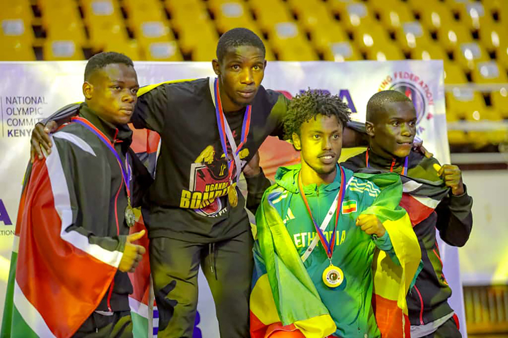 Featherweight Fatuma Nabikolo (centre) smiling for her gold during a medal podium at the just concluded Zone 3 Africa Boxing Championship in Kenya. (Courtesy photo)