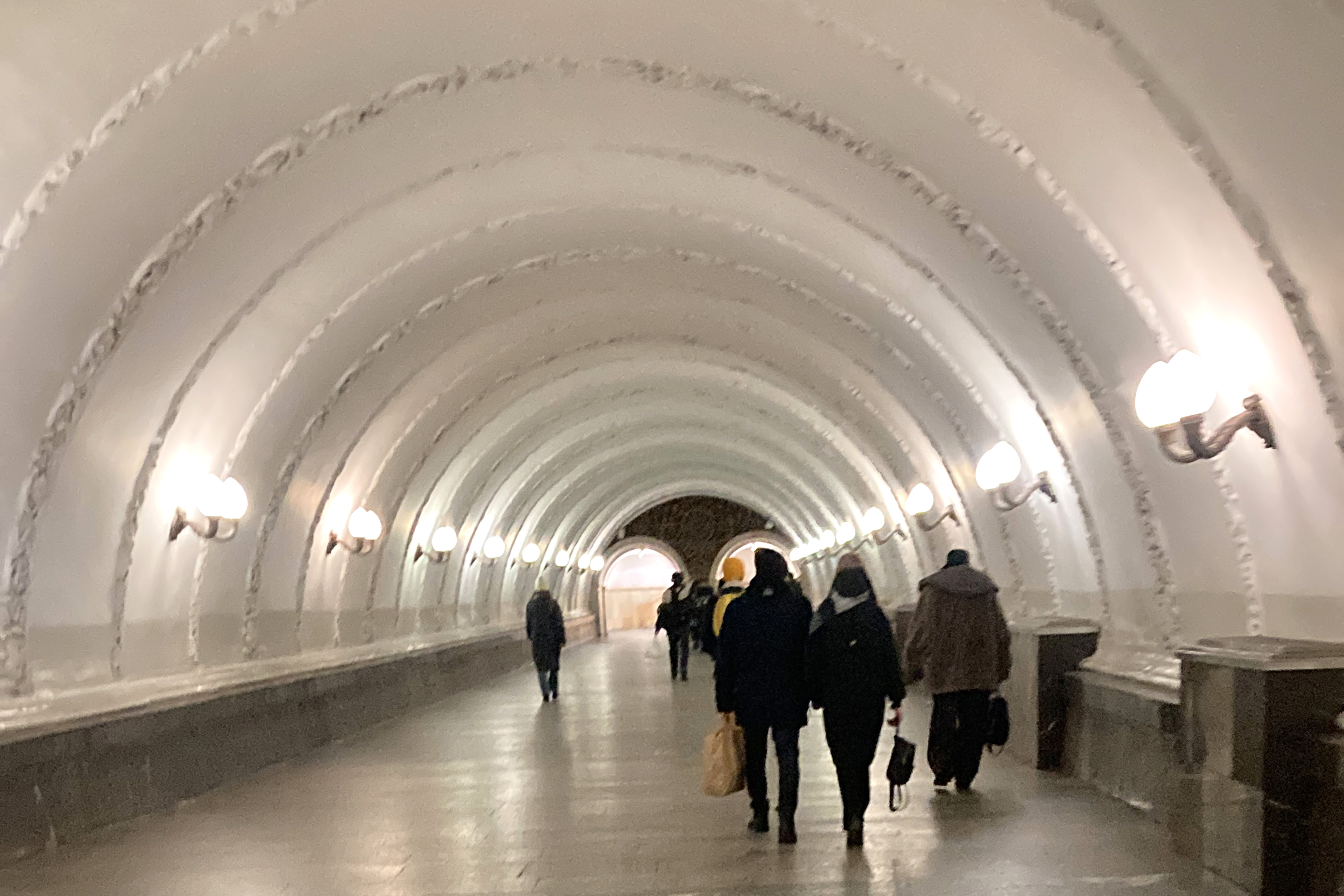 People walking inside the metro station in Moscow.