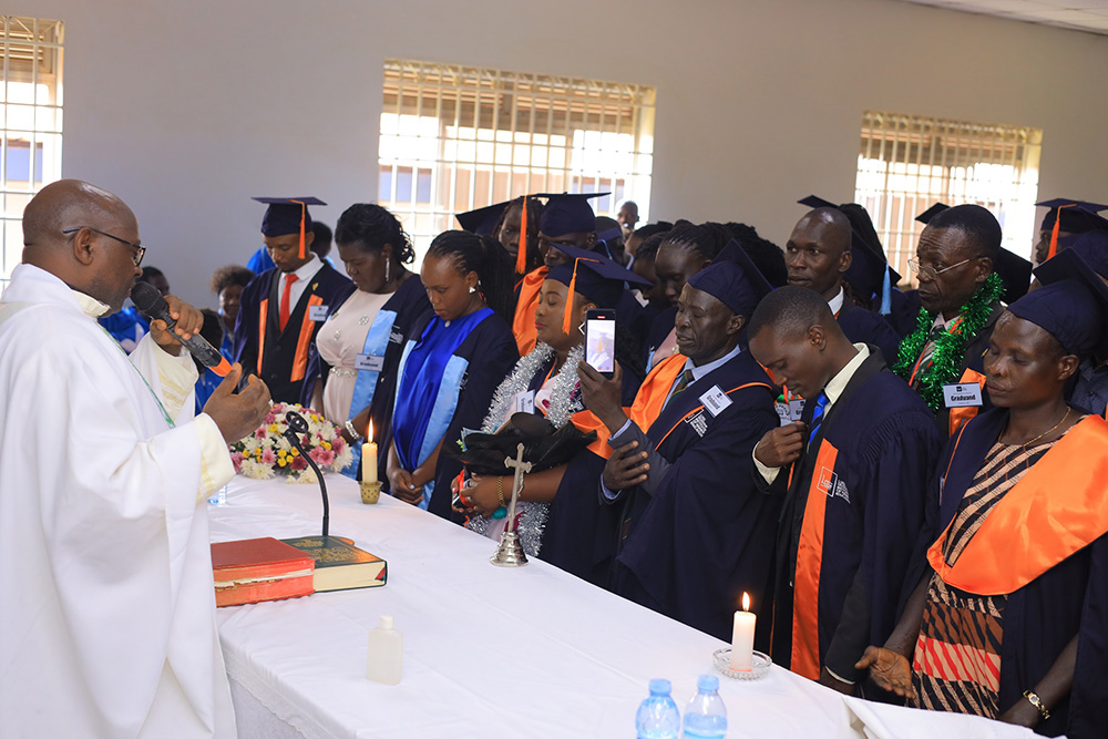 A priest blessing graduates during prayers before the graduation ceremony.(Courtesy photo)