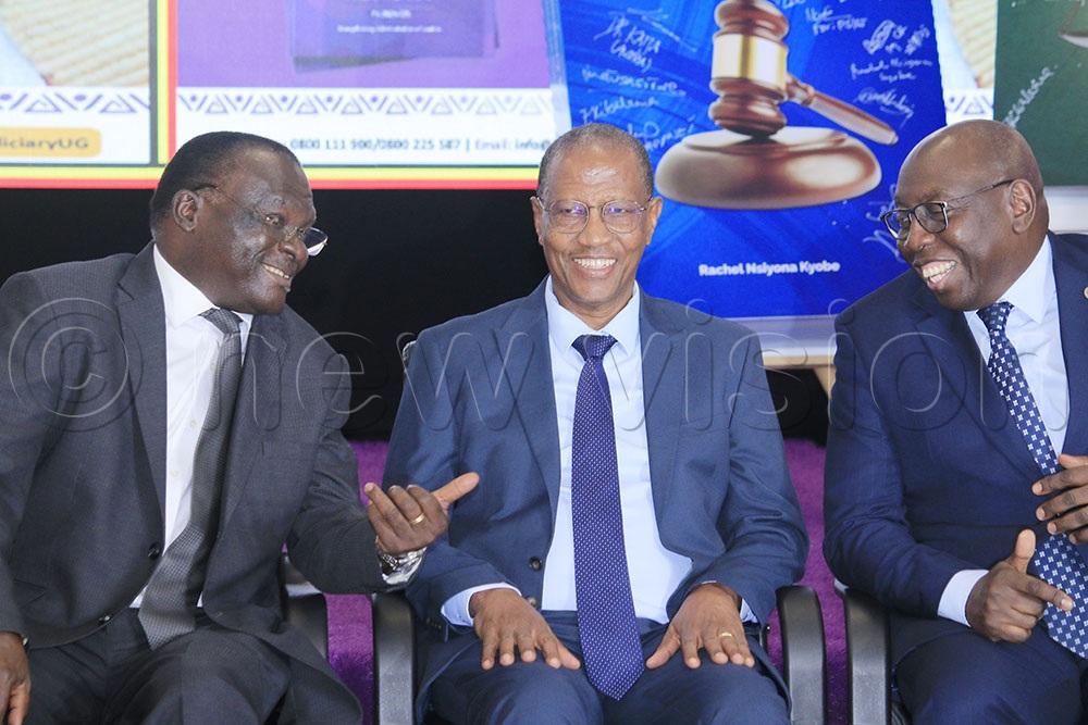(L-R) Chief Justice Alfonso Owinyi Dolo,  Deputy Chief Justice Richard Butera and Justice Geoffrey Kiryabwire interact during judicial annual report launch held in Kampala on September 23.  (Credit: Alfred Ochwo)