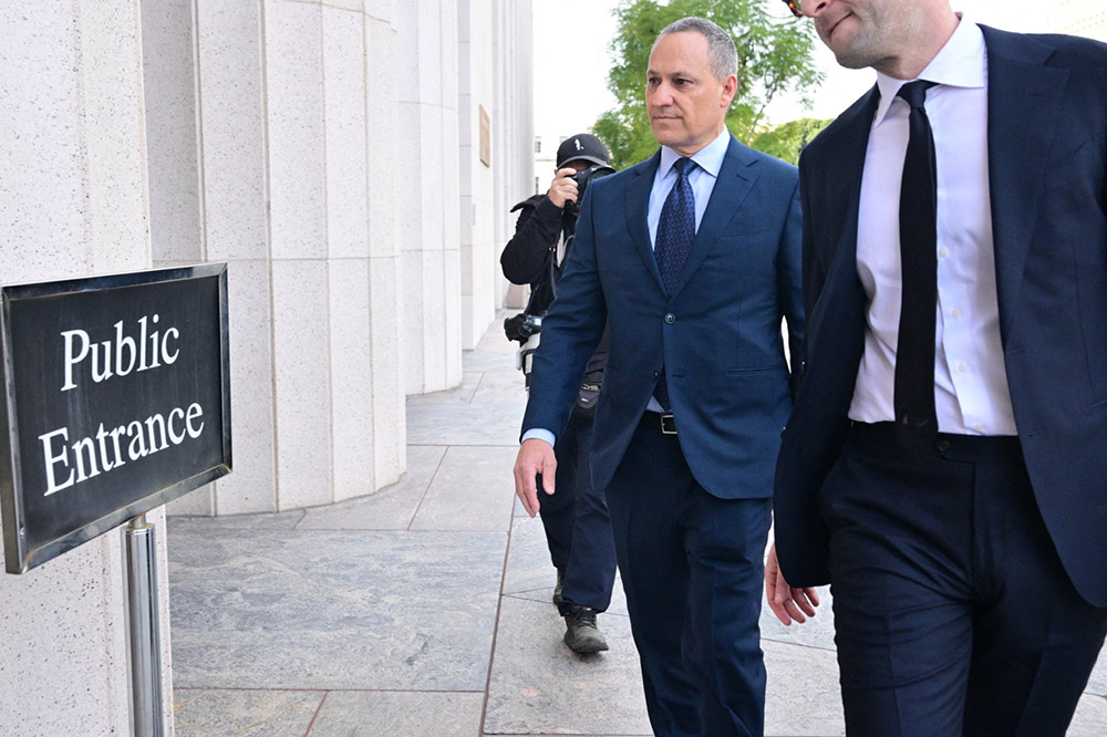 YouTube vice president of Engineering Cristos Goodrow (L) arrives to Los Angeles Superior Court for the social media trial tasked to determine whether social media giants deliberately designed their platforms to be addictive to children, in Los Angeles, on February 23, 2026. (Credit: AFP)
