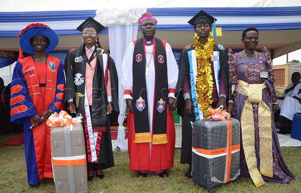 Bishop of the Church of Uganda Diocese of Soroti, Rt Rev. Kosea Odongo, taking a group photo with the overall best graduates of Ogolai Vocational Training Institute in Amuria district on Friday, July 17, 2026. (Credit: Delux Emmy Alomu)