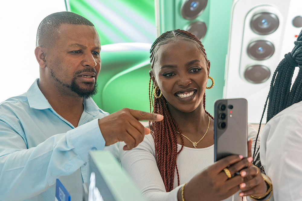 People walk past a Tecno store in Nairobi, Kenya, Oct. 13, 2026. (Xinhua/Geng Xinning)