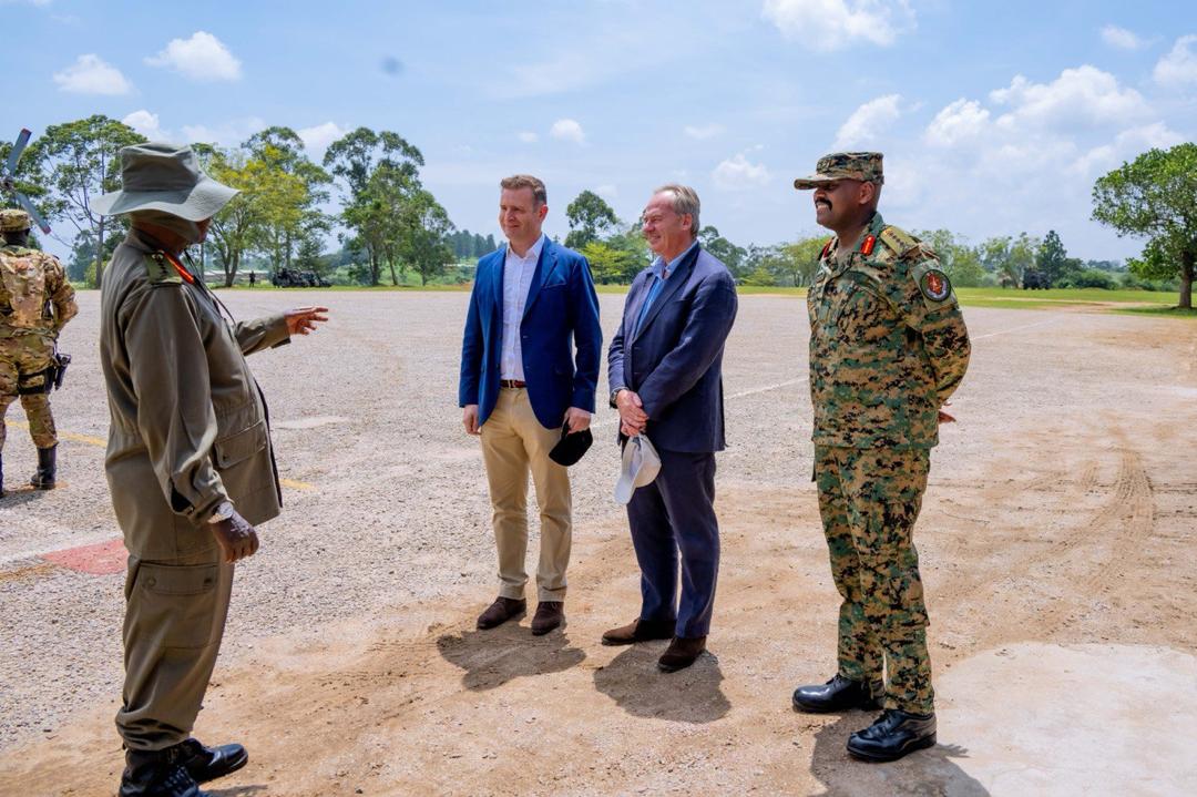 President Museveni interacting with the CDF, Muhoozi Kainerugaba, and former platoon commander and directing staff at the Royal Military Academy Sandhurst, Maj. Gen. Ben Kite and Mr Sam Instone, who was Gen. Kainerugaba’s colleague at the UK-based military institution. (Courtesy)