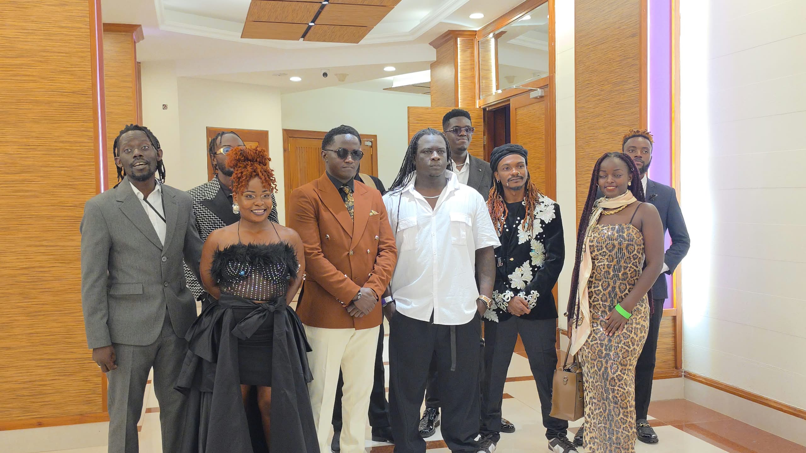 Sewa Sewa of the Janzi band ( White shirt) poses for a photo with friends ahead of the show. Photo Dius Walugembe