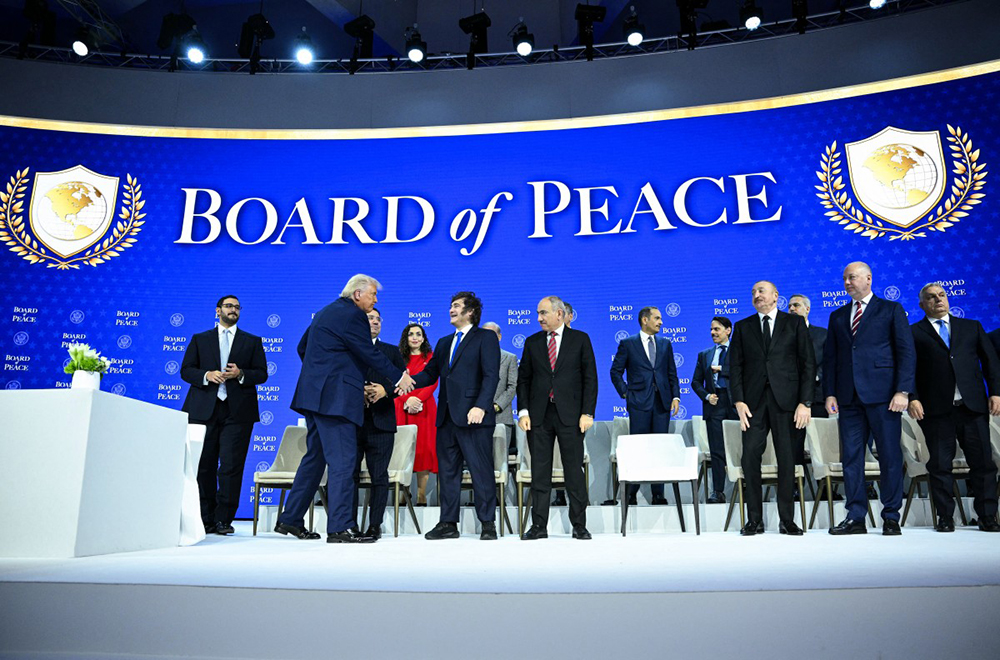 US President Donald Trump (2L) shakes hands with Argentina's President Javier Milei at the "Board of Peace" meeting during the World Economic Forum (WEF) annual meeting in Davos on January 22, 2026.