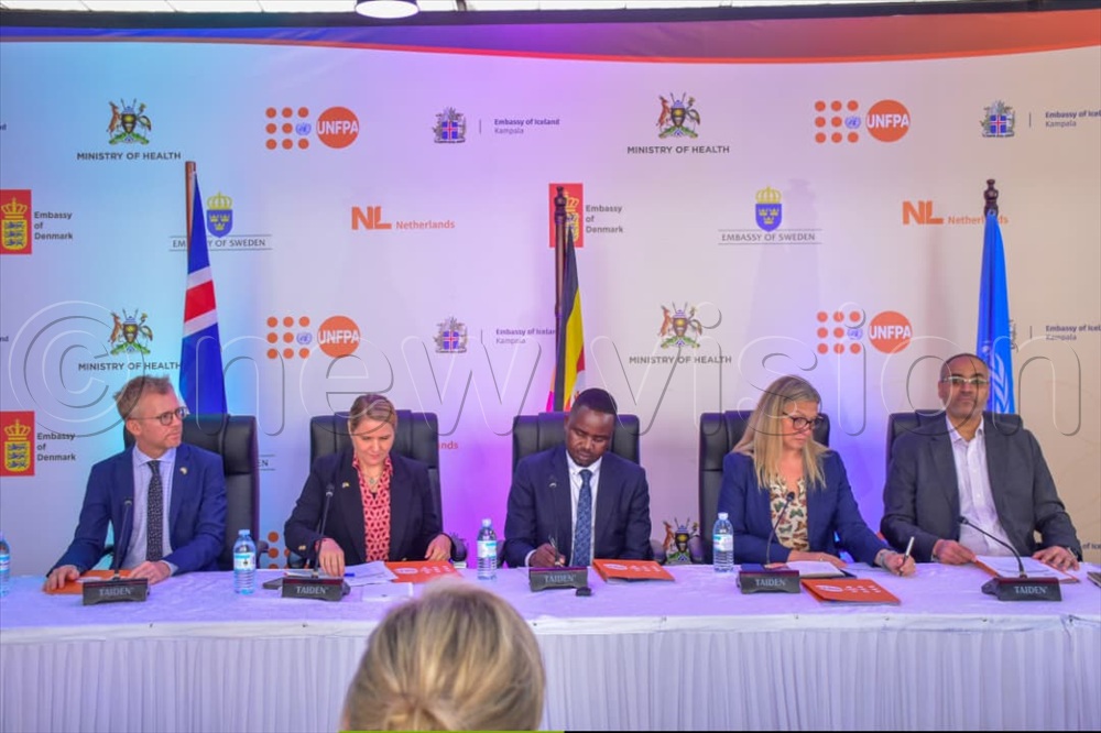  Officials during the signing of the funding agreement in Kampala. &nbsp;(Credit: Sharon Nabasirye)