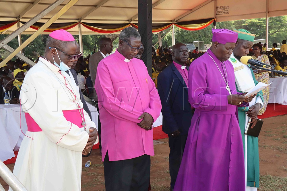 Religious leaders from Lango, led by Lango Diocese Bishop Prof. Alfred Olwa, say a prayer during the function at Lango College Playground. (Credit: Hudson Apunyo) 