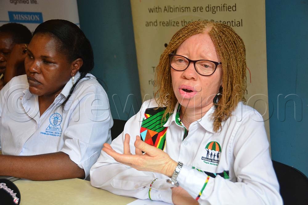 The executive director of Albinism Umbrella Olive Namutebi (right) and Esther Kyozira chief executive officer of NUDIPU addressing a press conference in Kampala on May 29, 2026. (Credit: Photo by Francis Emorut)