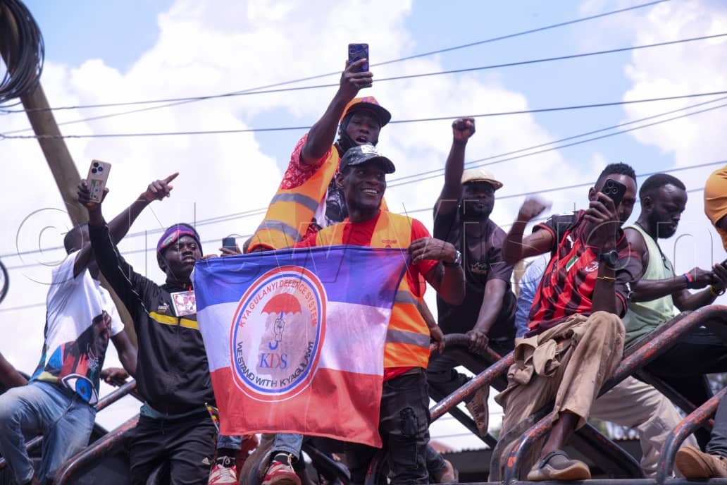 NUP supporters cheering during Kyagulanyi's campaign trail. (Credit: Ponsiano Nsimbi)