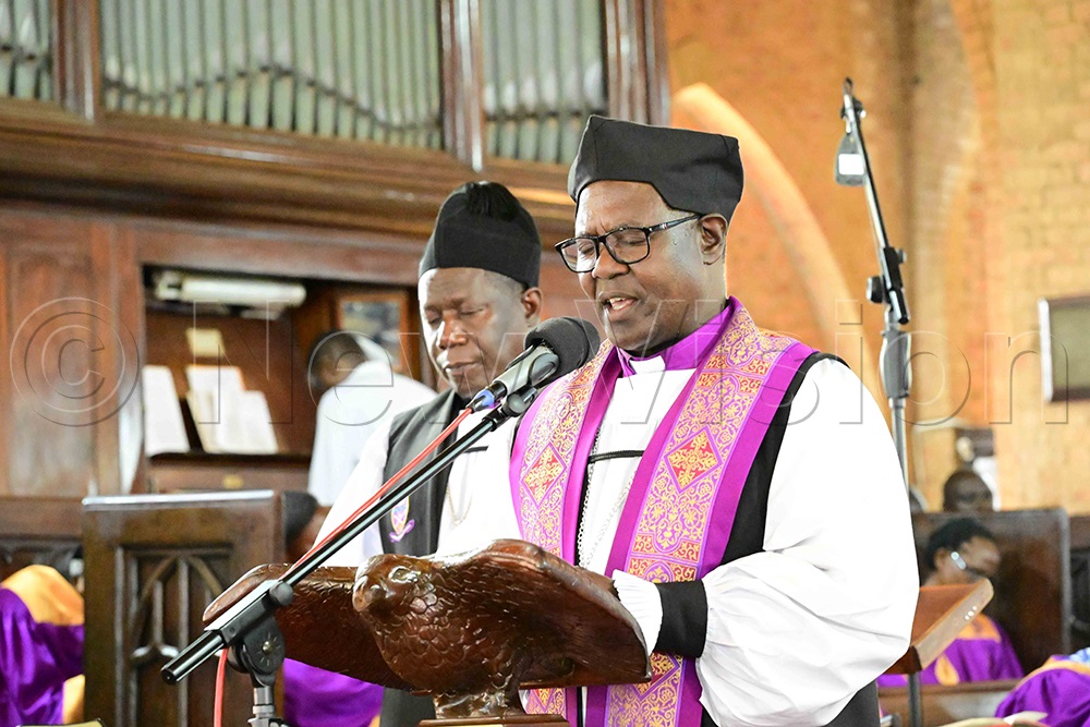 Former Bishop of West Buganda Diocese, Katumba Tamale, prays during the funeral service for the late Bishop Christopher Ssenyonjo. (Credit: Eddie Ssejjoba)