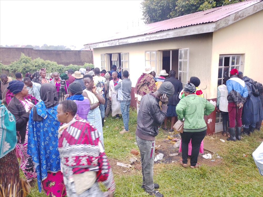 People gathered at the Hoima City mortuary trying to identify some of the dead bodies on Wednesday morning. (Photo by Wilson Asiimwe)