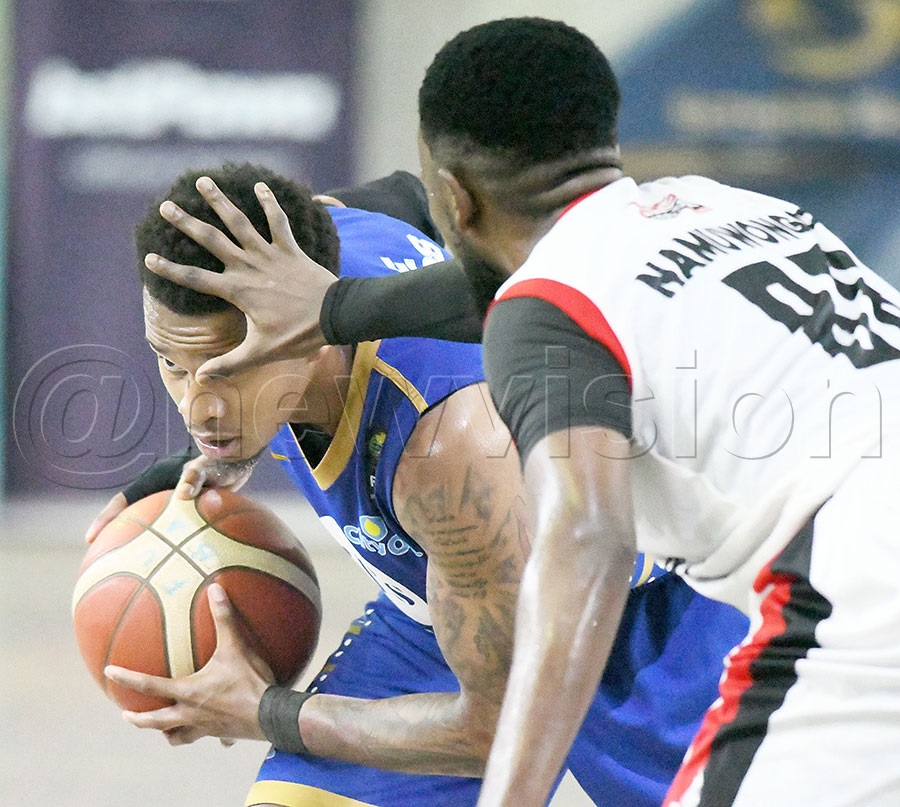 City Oilerss Jordan Bowie Chad (left) takes on Namuwongo Blazers Joel Lukoji during Game-3 of the best of 7 finals at Lugogo,  October 28, 2025. Blazers won 80-70. Photo by Michael Nsubuga