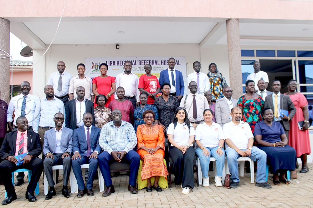 Dr Jane Aceng, the Government Chief Whip (C), poses for a photo with Ambrose Agec, the Chairperson of the Lango LCV and Mayor's Association (3rd L), Lira Hospital Director Dr Odur, other leaders and partners at the Regional Health Assembly in Lira. (Photo by Joseph Ekol)