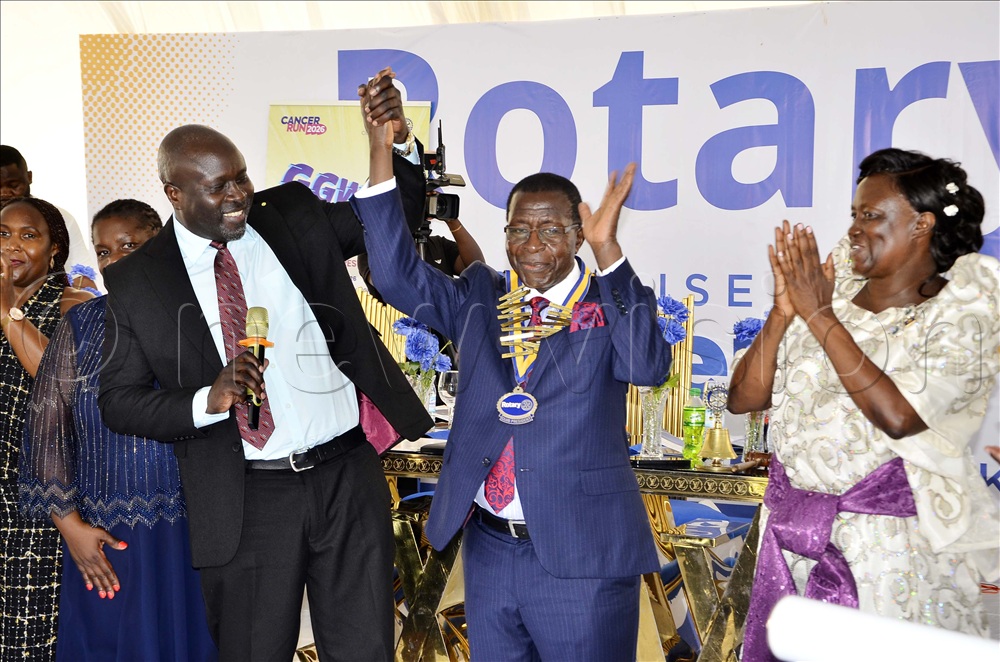 Hodge Semakula (centre) installed as the new president of Kampala Sunrise Rotary Club at his country home in Ndeeba village, Busiika Town Council in Luwero district on 1st May 2026. Looking on from left is Catherine Kijjaggulwe, Kampala Sunrise Rotary Club outgoing president, Gerald Obai, district governor 9213 and Lillibet Semakula. 