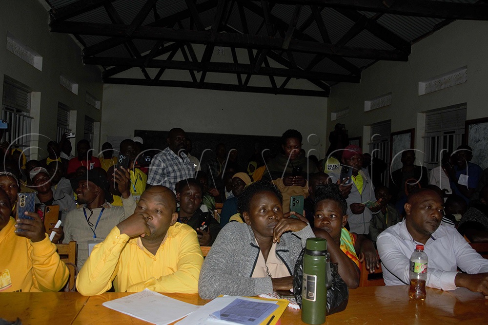 Dan Muhirwe and other candidates with their agents waiting for declaration of results on Friday at around 3 am. (Photo by Peter Abaanabasazi)