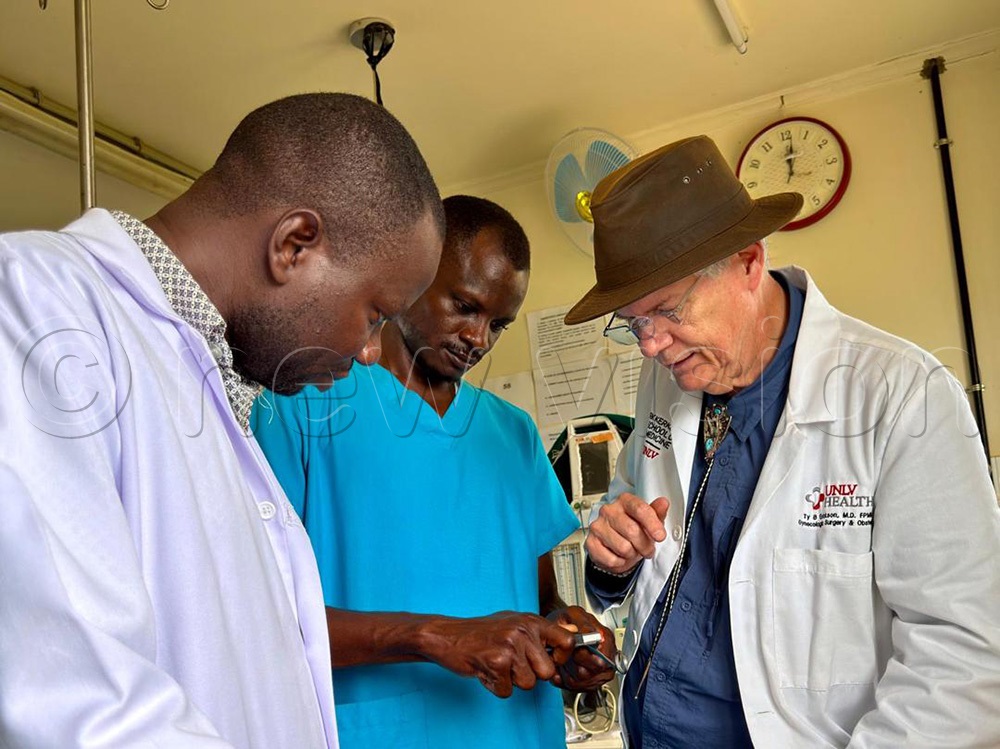 Dr. Bolton and Kidera Health Center 1V surgeon, Dr. Joel Mutaka (left) share a professional consultation moment. (Photo by Tom Gwebayanga)