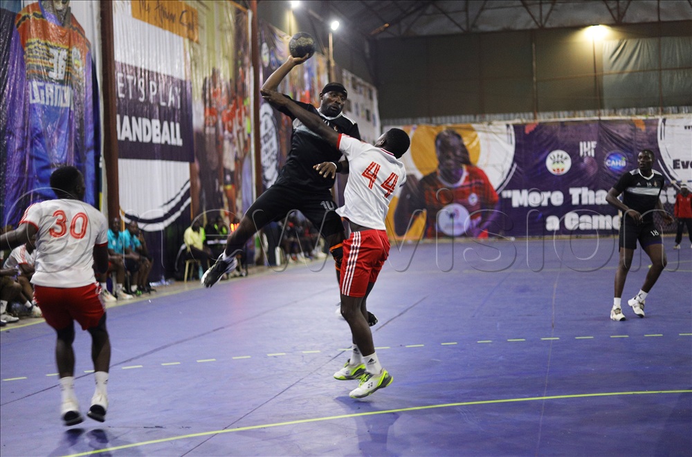 Prisons' goalkeeper Viola Azayo try to save the goal by Nairobi  Water's Mekina Andawa during their Game. Prisons lost 27-41. 