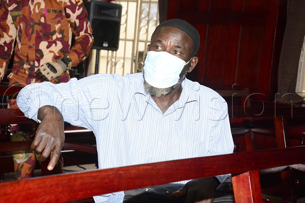 Jamilu Mukulu in court. Mukulu faces charges of murder and terrorism alongside 18 others. (Photo by Margret Zalwango)