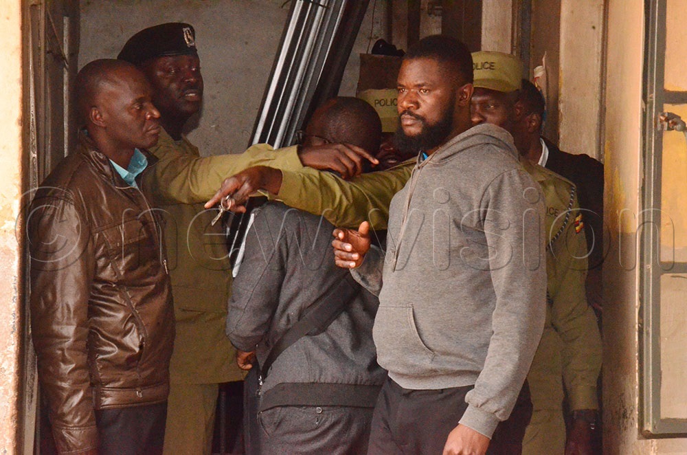 Suspect Nicholas Ogenga being paraded at Wandegeya Police station. (Photo by Agnes Kyotalengerire)