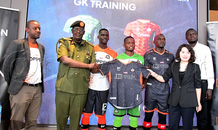 Lt. General James Mugira (second left) joins OPPEIN Managing Director Sherry Shi (Namutebi, second right) at the launch of the NEC FC jersey held at the CHINT building on Jinja Road, October 6, 2025.PHOTO: Silvano Kibuuka 