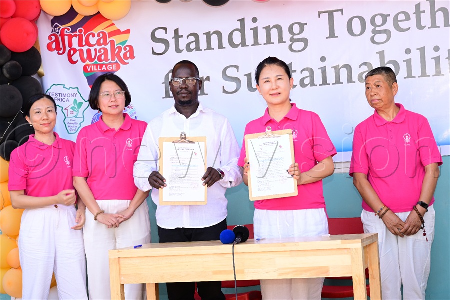 Fang signed a Memorandum of Understanding with the Africa Ewaka executive director, Gilbert Olinga, for a five-year collaboration and support. (Credit: Eddie Ssejjoba)