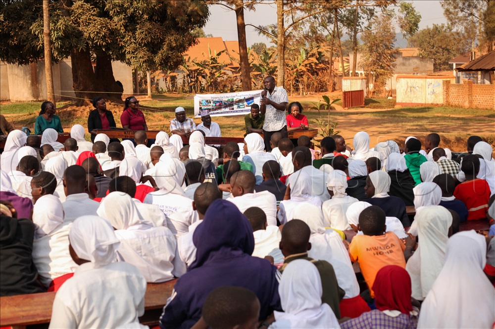 The Headteacher of Namusera UMEA Primary School, Jamir Kiwalabye, addressing some of the girls before the launch of the program.