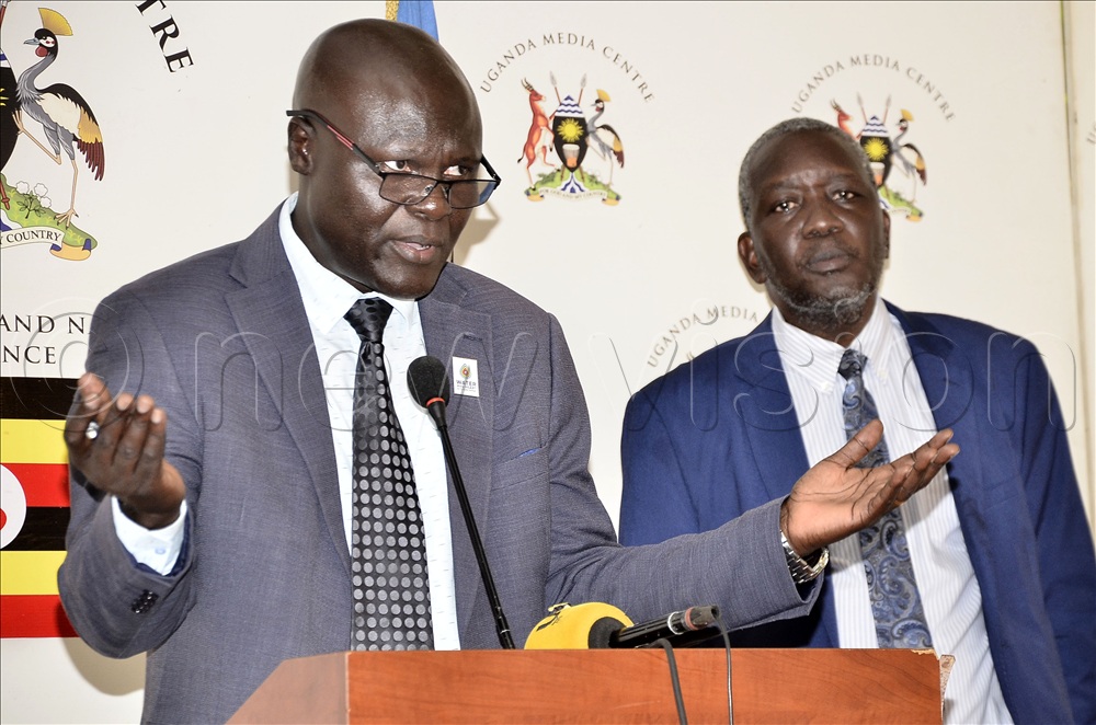 The Commissioner in charge of Meteorological Services at the Ministry of Water and Environment, Dr Bob Alex Ogwang (left) explains as the Permanent Secretary, Ministry of Water and Environment Dr Alfred Okot Okidi looks on during a press conference on rainfall forecast at Media Center Kampala on Friday, 27 2026.