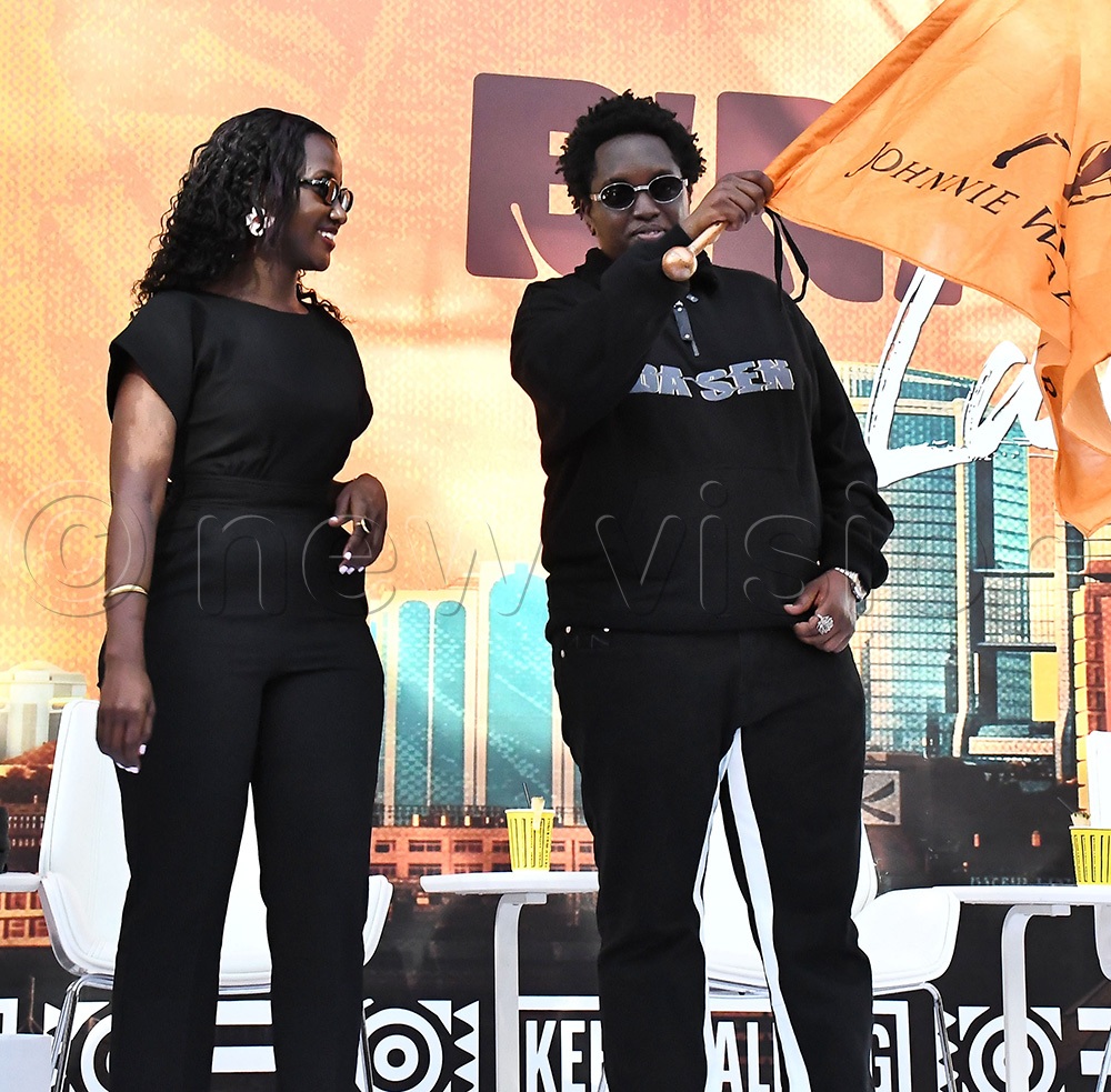 Joshua Baraka after being flagged off by Christine Kyokunda the Brand Manager Johnnie Walker at 1420 bar in Bugoloobi. (Photo by Ignatius Kamya)