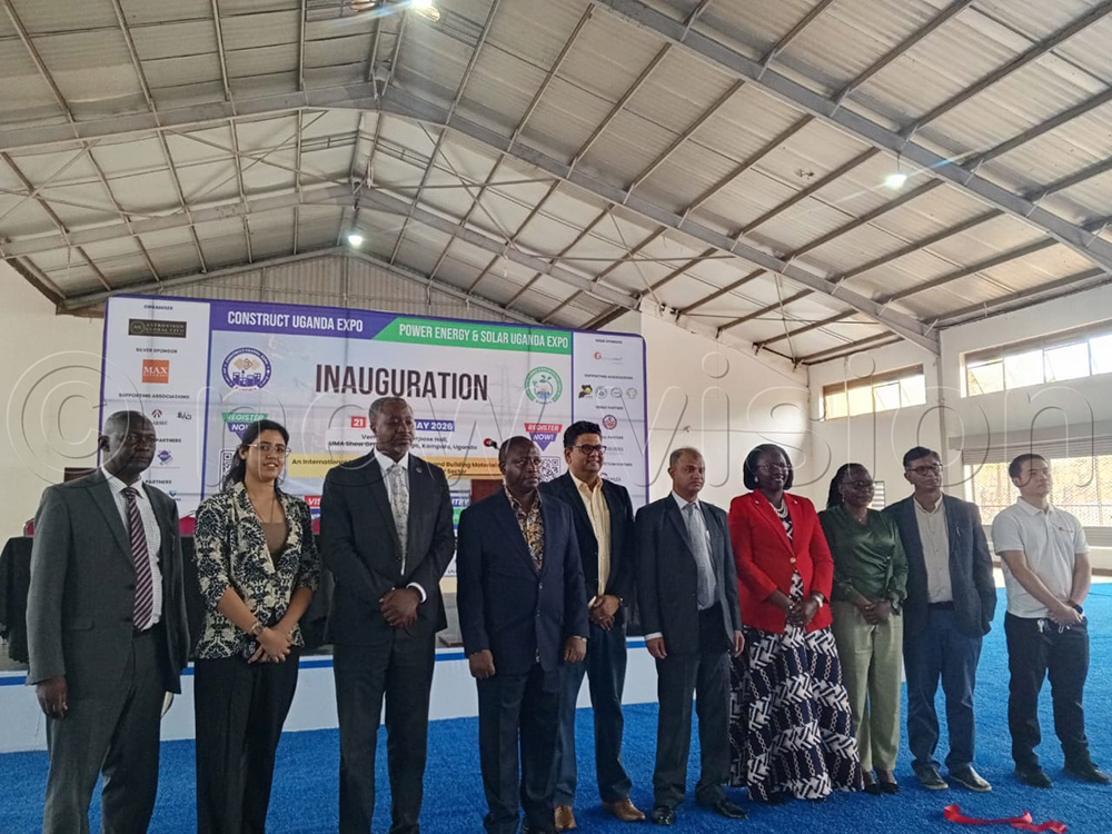 Outgoing state minister for trade, David Bahati posing for a photo with the organisers of the Uganda Construction Expo 2026. (Photo by Nelson Kiva)