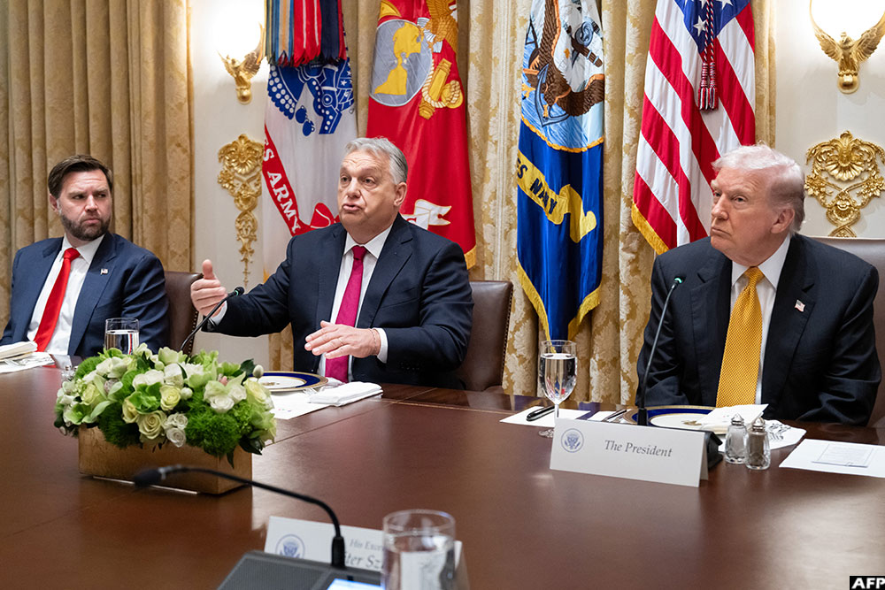 Hungarian Prime Minister Viktor Orban (C) speaks as US Vice President JD Vance (L) and President Donald Trump (R) look on during a meeting at the White House in Washington, DC on November 7, 2025.