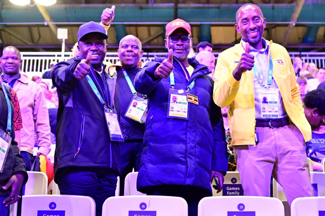 Uganda's Sports Minister Peter Ogwang (left) poses with fellow officials in Glasgow. (Courtesy/Nicholas Bamulanzeki)